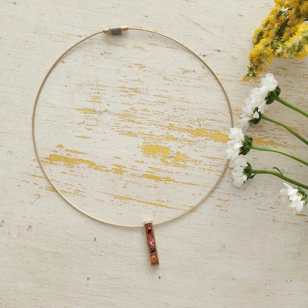 Elegant Gold Pendant Necklace with Red and Orange Accents